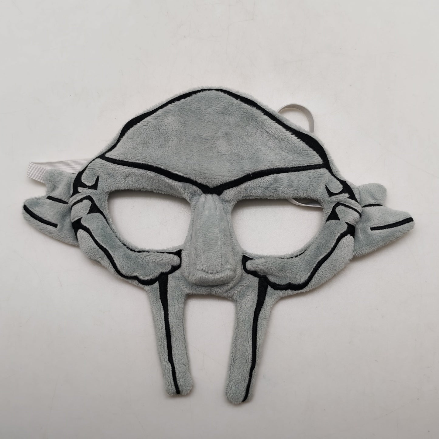 Gray mask with black accents on a white background